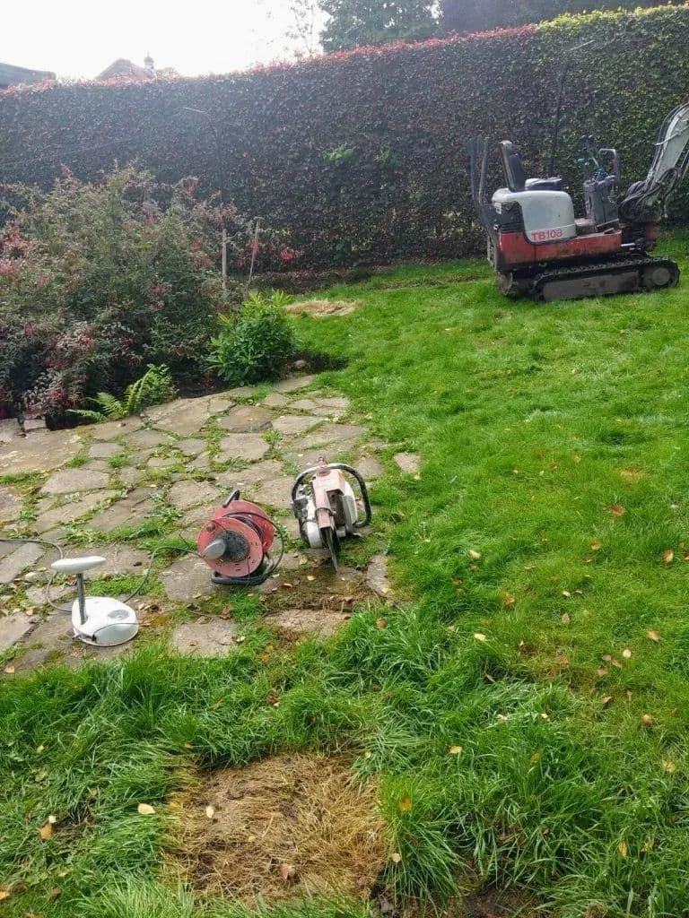 The old crazy paving and rough grass before the new patio went in