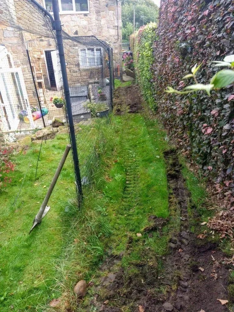 A trench dug along the hedge line during the build
