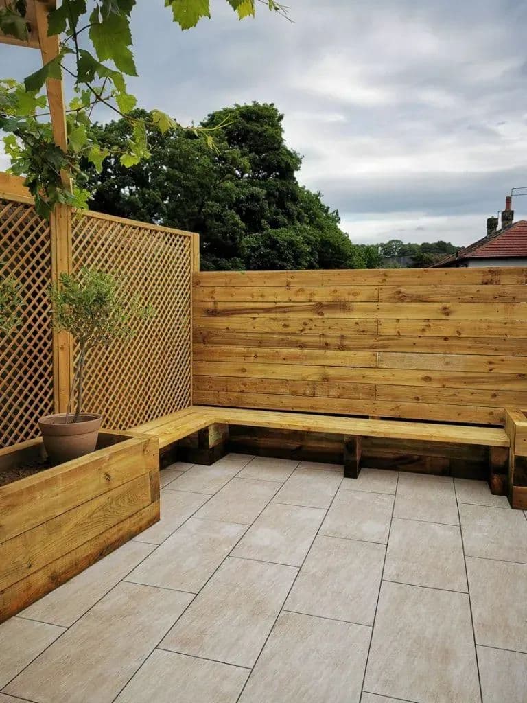 The corner of the patio where the timber bench meets the trellis screen
