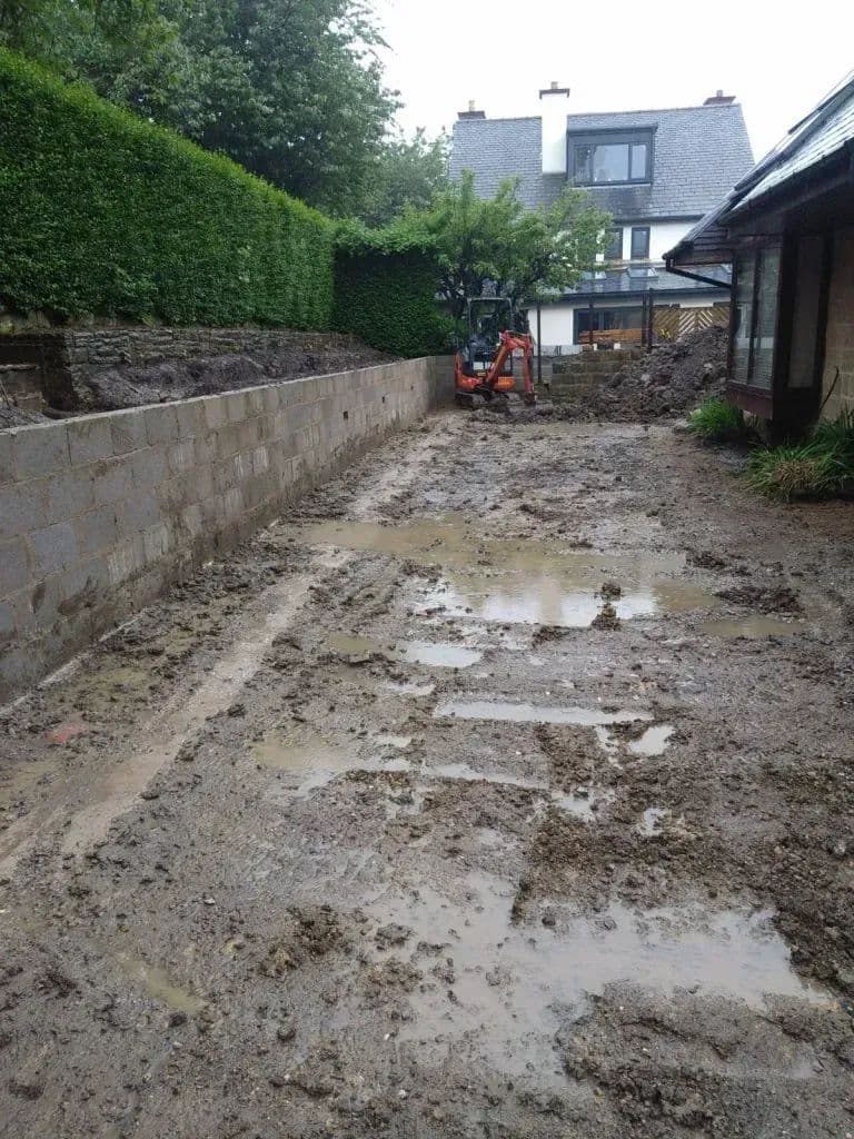The garden churned to mud after the rainstorms part-way through the build