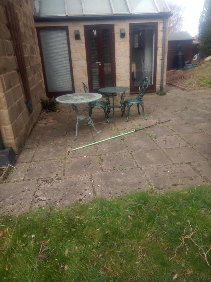 The old paving and lawn outside the house before work started