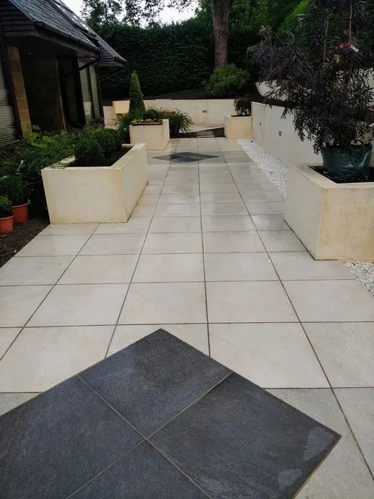 Rendered planters running along the terrace with a slate diamond set into the paving
