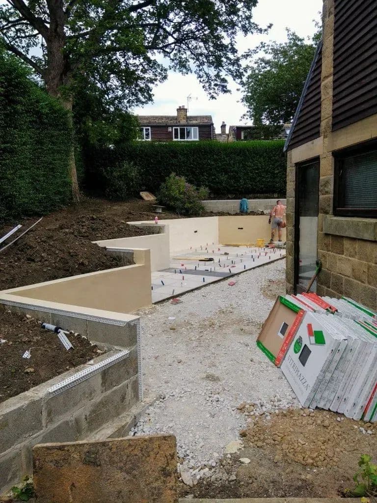 The rendered planters and retaining walls taking shape across the middle of the garden