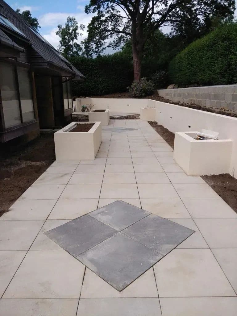 The finished terrace from the top of the garden, with the slate diamond in the paving