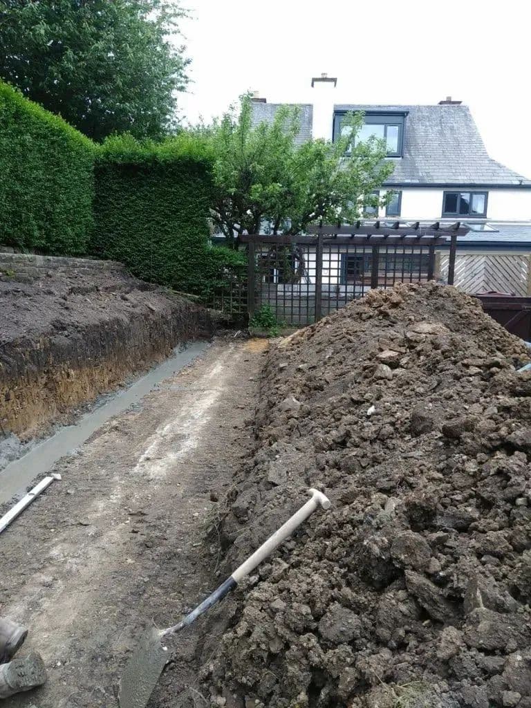 A trench dug along the boundary with the spoil heaped alongside it